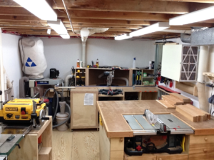 power tools in a small basement woodworking shop