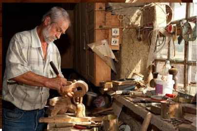 man carving with japanese wood chisels