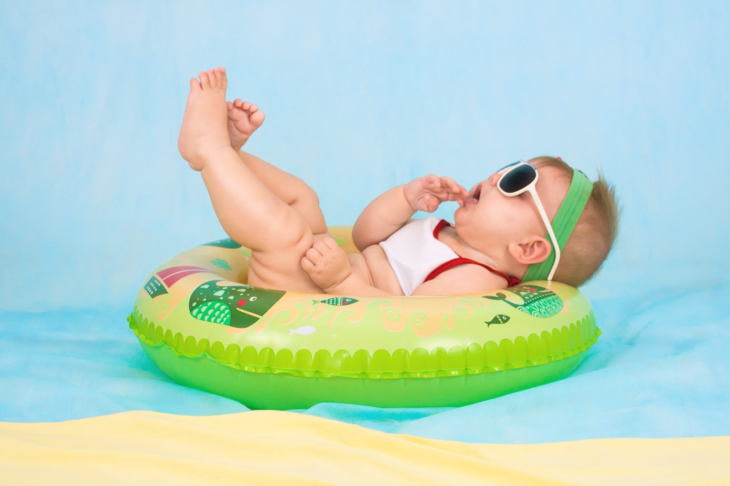 baby enjoying enjoying the best baby pool float